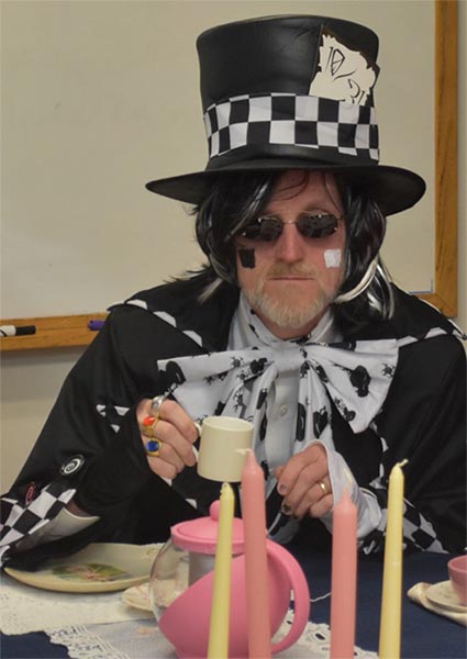 a man dressed in a mad hatter costume