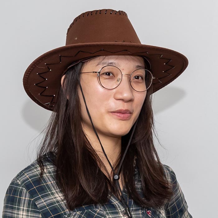 a woman wearing a cowboy hat